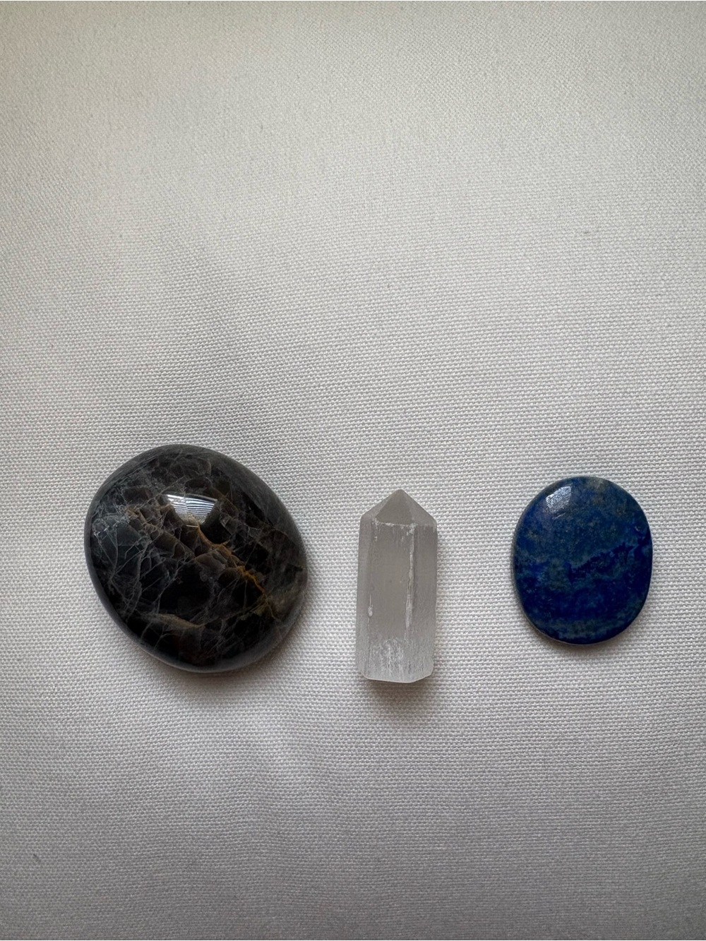 Crystal trio: lapis lazuli, black moonstone and selenite
